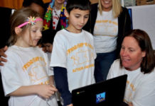 Real estate firm donates 10 laptop computers to Boston school’s autism program. (March 2017)