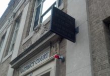 Work stoppage continues as legislature fails to include more pay for public defender bar advocate in latest budget Stock photograph of East Boston District Court