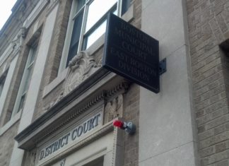 Work stoppage continues as legislature fails to include more pay for public defender bar advocate in latest budget Stock photograph of East Boston District Court