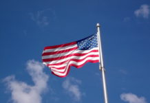 Local GOP ward committee offering free American flags American Flag in Central Square East Boston
