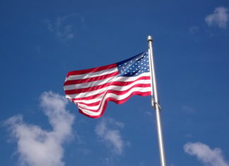 Local GOP ward committee offering free American flags American Flag in Central Square East Boston