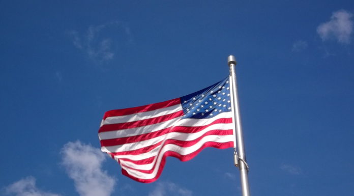 Local GOP ward committee offering free American flags American Flag in Central Square East Boston