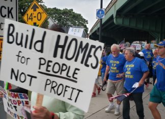 Protesting over-development of luxury housing, Stand Up For Eastie takes to the streets