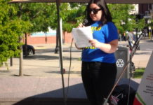 Joni DiMarzo of Stand Up For Eastie spreads her message at Mutual Aid Eastie event in Central Square