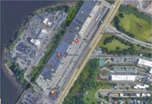 Local residents form “Committee in Support of an East Boston Haul Road” adjacent to McClellan Highway