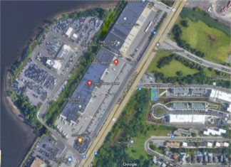 Local residents form “Committee in Support of an East Boston Haul Road” adjacent to McClellan Highway