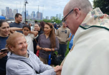 A moving spiritual experience, local Catholics greet Archbishop Henning at Piers Park