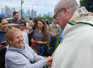 A moving spiritual experience, local Catholics greet Archbishop Henning at Piers Park