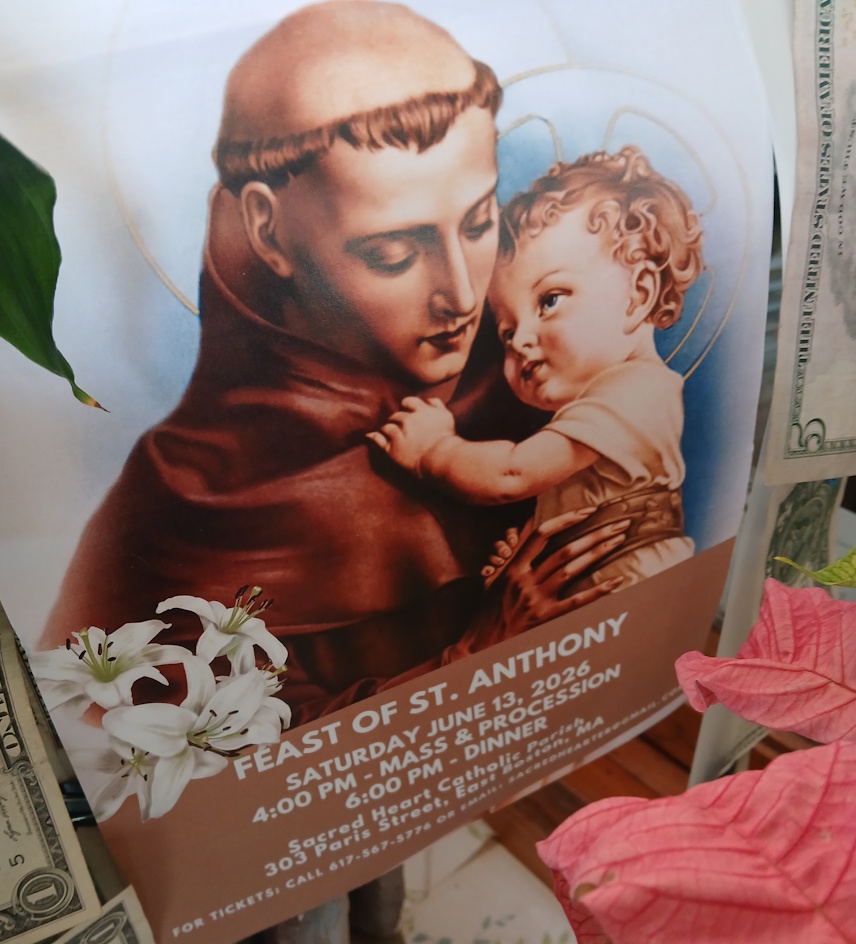 Poster image of Saint Anthony holding Baby Jesus, with a brown banner that reads 'Feast of St. Anthony' and event details (date, time) visible in the lower portion.
