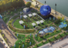 A big soccer ball is coming to East Boston’s waterfront Aerial view of a waterfront festival with white tents, a circular lawn, a large blue inflatable stage, seating areas, and a water feature.