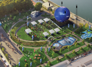 A big soccer ball is coming to East Boston’s waterfront Aerial view of a waterfront festival with white tents, a circular lawn, a large blue inflatable stage, seating areas, and a water feature.