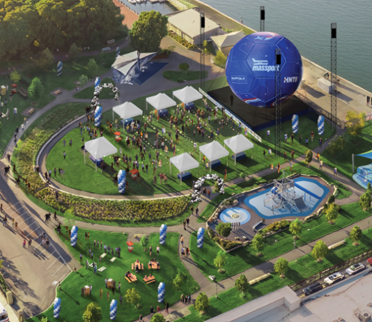 A big soccer ball is coming to East Boston’s waterfront Aerial view of a waterfront festival with white tents, a circular lawn, a large blue inflatable stage, seating areas, and a water feature.