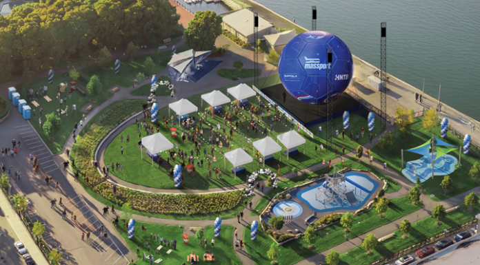 A big soccer ball is coming to East Boston’s waterfront Aerial view of a waterfront festival with white tents, a circular lawn, a large blue inflatable stage, seating areas, and a water feature.