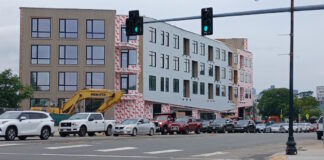 Bicycle advocates upset with city revision to traffic calming by behemoth housing project in congested neighborhood.