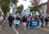 Behind in polls, Minogue voices confidence and touts early voting