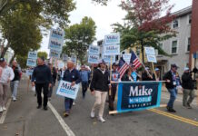 Behind in polls, Minogue voices confidence and touts early voting