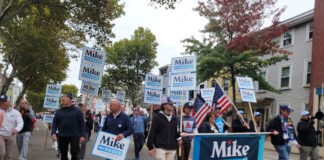 Behind in polls, Minogue voices confidence and touts early voting